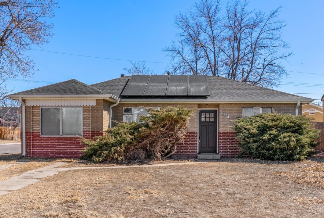 Single-story brick house with solar panels